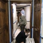 DAAR volunteers painting hallways