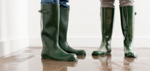 Rubber boots on wet floor, view full size
