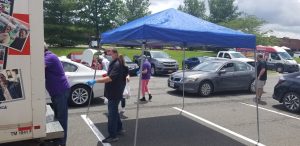 Workers collecting food at food drive