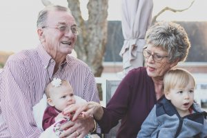 Seniors holding grandchildren