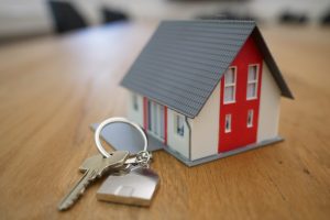 Miniature Home with Keys for scale.