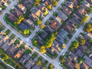 Aerial view of residential houses and driveways 